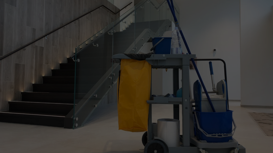 hero1 (1) Disinfecting staircase railing with spray bottle